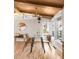 Bright dining space with hardwood floors, a glass table, and plenty of natural light at 3242 4Th St, Boulder, CO 80304