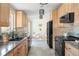 Updated kitchen boasts modern appliances, stone countertops, and adjacent breakfast nook at 3242 4Th St, Boulder, CO 80304