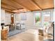 Bright living room with wood beam ceiling, skylights, and modern décor at 3242 4Th St, Boulder, CO 80304