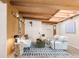 Bright living room with wood beam ceiling, skylights, and modern décor at 3242 4Th St, Boulder, CO 80304