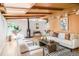 Bright living room with wood beam ceiling, modern fireplace, and stylish décor at 3242 4Th St, Boulder, CO 80304