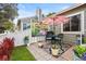 Private back yard with a patio, seating area, and lush green lawn at 7 Shetland Ct, Highlands Ranch, CO 80130