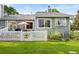 Charming home featuring a private, fenced backyard, patio with umbrella, and well-maintained lawn at 7 Shetland Ct, Highlands Ranch, CO 80130