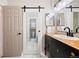 Modern bathroom features a sliding door, accent lighting, and contemporary fixtures at 7 Shetland Ct, Highlands Ranch, CO 80130