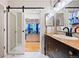 Modern bathroom features a sliding door, closet, accent lighting, and contemporary fixtures at 7 Shetland Ct, Highlands Ranch, CO 80130