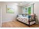 Bright bedroom featuring a cozy bed and natural light at 7 Shetland Ct, Highlands Ranch, CO 80130