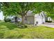 Beautiful home exterior featuring a well-maintained lawn and a charming garden under a large tree at 7 Shetland Ct, Highlands Ranch, CO 80130