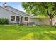 Inviting home showcasing a lush front yard with mature trees and tasteful landscaping at 7 Shetland Ct, Highlands Ranch, CO 80130