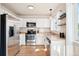 Modern kitchen features stainless steel appliances and bright cabinetry at 7 Shetland Ct, Highlands Ranch, CO 80130