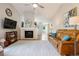 Spacious living room featuring a fireplace, ceiling fan, and comfortable leather seating at 7 Shetland Ct, Highlands Ranch, CO 80130