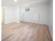 Bright basement area with wood-look flooring, perfect for a home office, gym, or entertainment area at 7659 S Holland Way, Littleton, CO 80128