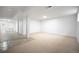 Spacious finished basement with neutral carpet and tile flooring, ready for customization and entertainment at 7659 S Holland Way, Littleton, CO 80128