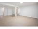 Open basement with carpet and tile, showcasing a flexible layout for various uses at 7659 S Holland Way, Littleton, CO 80128