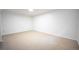 Bright basement area featuring neutral carpet, ready to be transformed into a functional living space at 7659 S Holland Way, Littleton, CO 80128