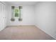 Bright bedroom featuring a large closet and natural light from a window at 7659 S Holland Way, Littleton, CO 80128