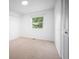 Bright bedroom featuring a built in closet and natural light from a window at 7659 S Holland Way, Littleton, CO 80128