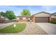 Charming ranch home with brick accents, a well-kept lawn, and an attached two-car garage at 7659 S Holland Way, Littleton, CO 80128