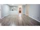 Spacious living room features new laminate flooring, fresh paint, and ample natural light at 7659 S Holland Way, Littleton, CO 80128