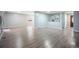 Bright living room boasts new flooring and neutral tones, offering a versatile living space at 7659 S Holland Way, Littleton, CO 80128