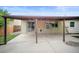 Back of home shows covered patio, and siding at 7659 S Holland Way, Littleton, CO 80128