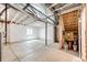 Unfinished basement with concrete flooring, white walls, and exposed ceiling with visible ductwork at 985 S Elk Way, Aurora, CO 80018