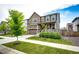 Attractive exterior view of a two-story home featuring a well-manicured lawn and inviting landscaping at 985 S Elk Way, Aurora, CO 80018