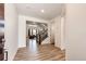 Bright foyer with wood-look flooring, staircase, and open access to the living areas of the home at 985 S Elk Way, Aurora, CO 80018
