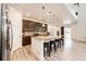 Bright kitchen features a large center island with seating and stainless steel appliances at 985 S Elk Way, Aurora, CO 80018