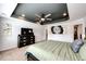 Spacious main bedroom features tray ceilings, a ceiling fan, and a modern color palette at 985 S Elk Way, Aurora, CO 80018