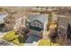 Aerial view of the home showcasing the roof, landscaping, and surrounding neighborhood at 9230 W Indore Dr, Littleton, CO 80128