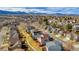 Well-kept neighborhood with sidewalks and green spaces and mountain view at 9230 W Indore Dr, Littleton, CO 80128