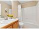 Bathroom with a tub-shower combination and a stylish vanity, offering a clean and functional space at 9230 W Indore Dr, Littleton, CO 80128