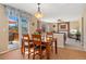 Cozy dining area near living room and patio doors at 9230 W Indore Dr, Littleton, CO 80128