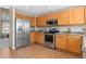 Bright kitchen with stainless appliances and ample counter space at 9230 W Indore Dr, Littleton, CO 80128