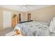 Bright and airy main bedroom featuring a comfortable bed and ample closet space, providing a peaceful retreat at 9230 W Indore Dr, Littleton, CO 80128