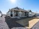 Expansive backyard featuring a covered patio, well-maintained lawn, and professional landscaping at 9035 S Shawnee Ct, Aurora, CO 80016