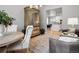 Open-concept dining area adjacent to the kitchen, featuring stylish decor and ample natural light at 9035 S Shawnee Ct, Aurora, CO 80016