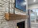 Close up of stone fireplace with mantle at 9035 S Shawnee Ct, Aurora, CO 80016