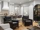 Open floor plan showcasing the living room leading into kitchen, and featuring a sliding barn door at 9035 S Shawnee Ct, Aurora, CO 80016