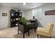 Office with a black desk, hutch, chair, and window at 9035 S Shawnee Ct, Aurora, CO 80016