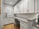 Well-organized pantry with custom shelving, ample storage, and stylish design perfect for all your needs at 9035 S Shawnee Ct, Aurora, CO 80016