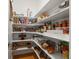 Organized walk-in pantry with shelving for ample food storage at 9035 S Shawnee Ct, Aurora, CO 80016