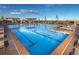 Relaxing pool area with lounge chairs, pergola and a clear blue swimming pool at 9035 S Shawnee Ct, Aurora, CO 80016