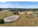 Aerial view of property highlighting horse enclosures, offering ample space and equestrian amenities at 20155 E Davies Ave, Centennial, CO 80016