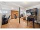 Finished basement featuring a desk, fireplace, seating area, and a pinball machine at 20155 E Davies Ave, Centennial, CO 80016