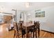 Dining room featuring hardwood floors and a large wooden table with seating for six at 20155 E Davies Ave, Centennial, CO 80016