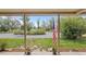 Front porch decorated with flower pots and an American flag in the front yard at 20155 E Davies Ave, Centennial, CO 80016