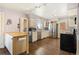 Bright kitchen with stainless steel appliances, white cabinets, and hardwood floors at 20155 E Davies Ave, Centennial, CO 80016