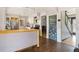 Open kitchen featuring stainless steel appliances, white cabinetry, butcher block island, and an adjacent dining area at 20155 E Davies Ave, Centennial, CO 80016