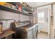 Well-equipped laundry room featuring a washer and dryer, ample shelving, and a neutral color scheme at 20155 E Davies Ave, Centennial, CO 80016